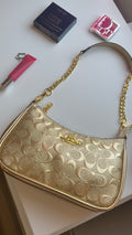 Gold purse with gold straps