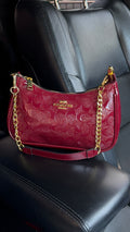 Burgundy purse with gold straps