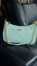 Soft green purse with gold straps