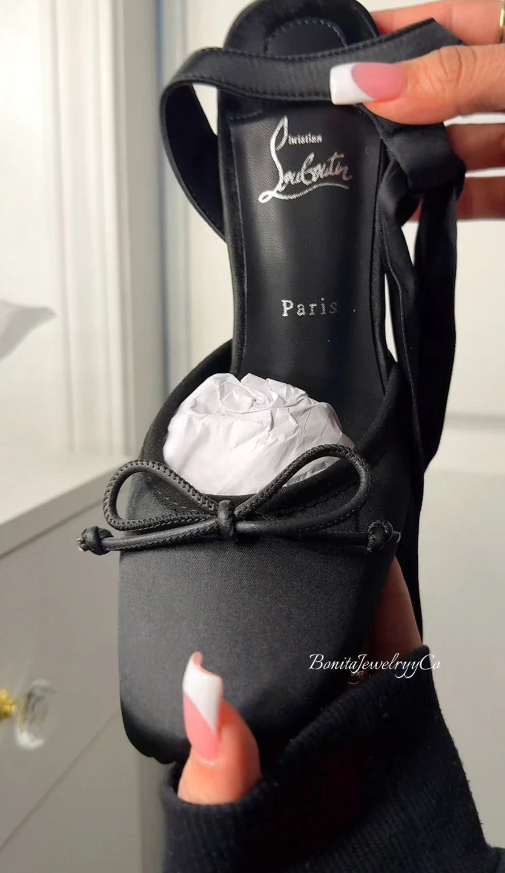 Black ballerina heels with red sole