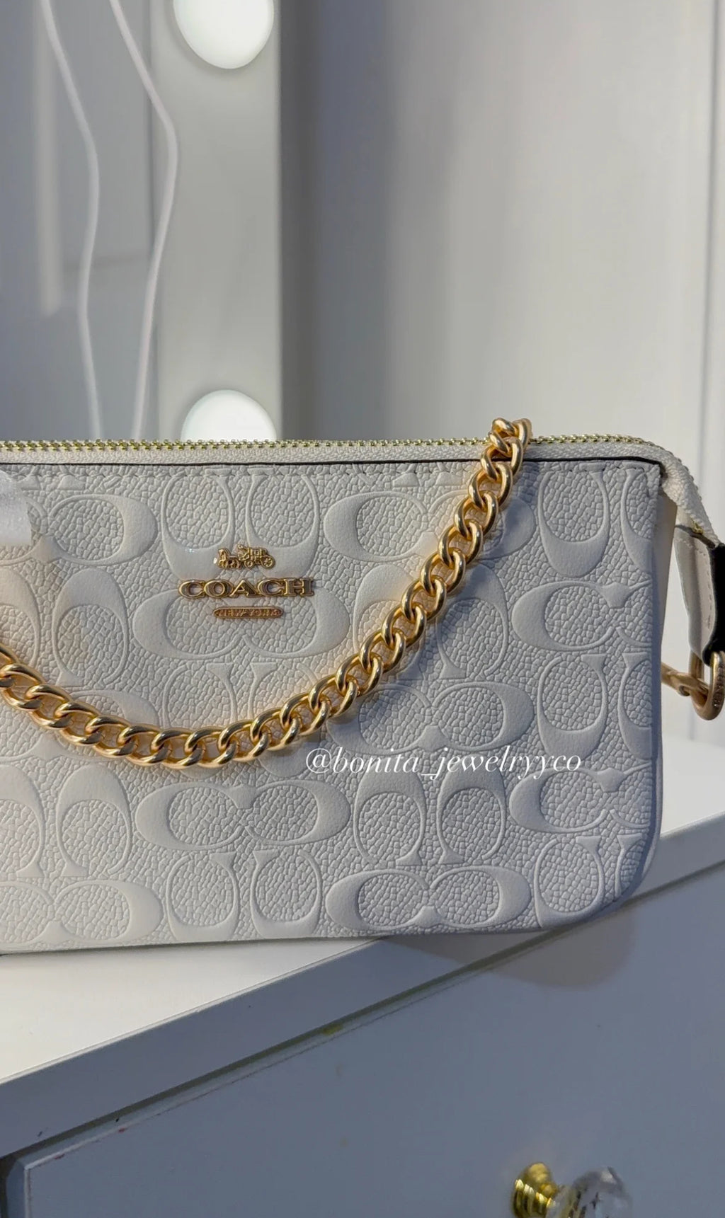 White monogram purse with rose gold straps