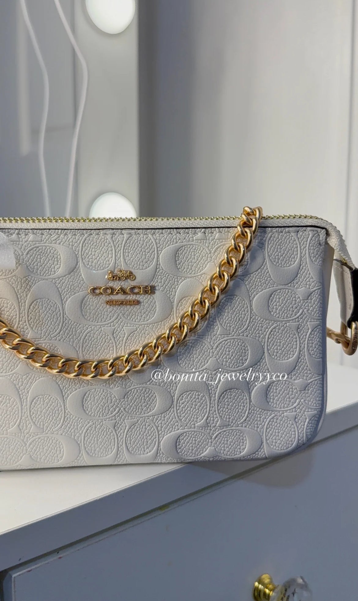 White monogram purse with rose gold straps