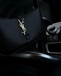 Black purse with gold lettering