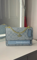 Blue purse with gold strap