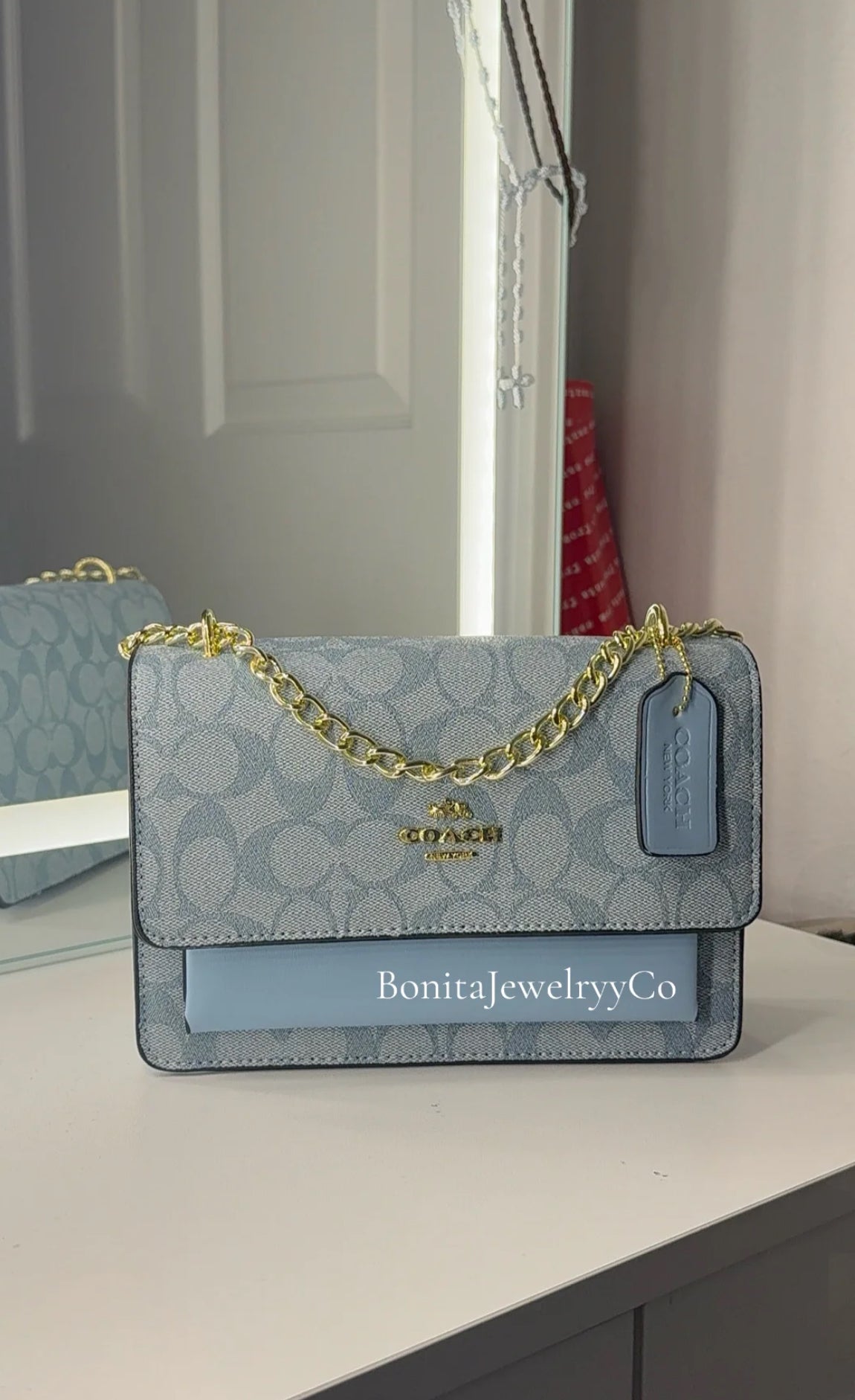 Blue purse with gold strap