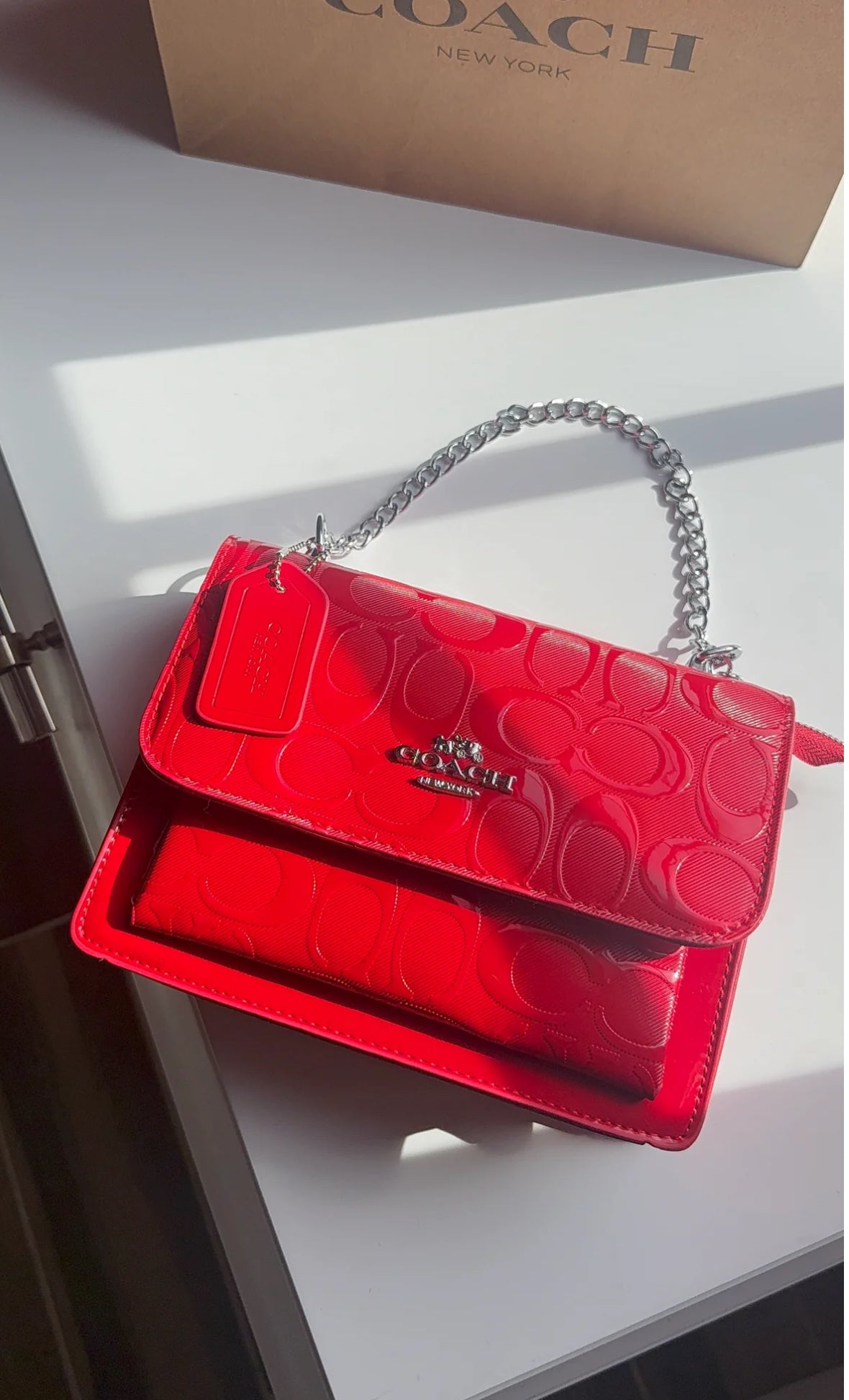 Red purse with silver straps