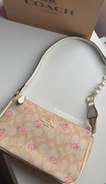 Floral purse with pearl extender