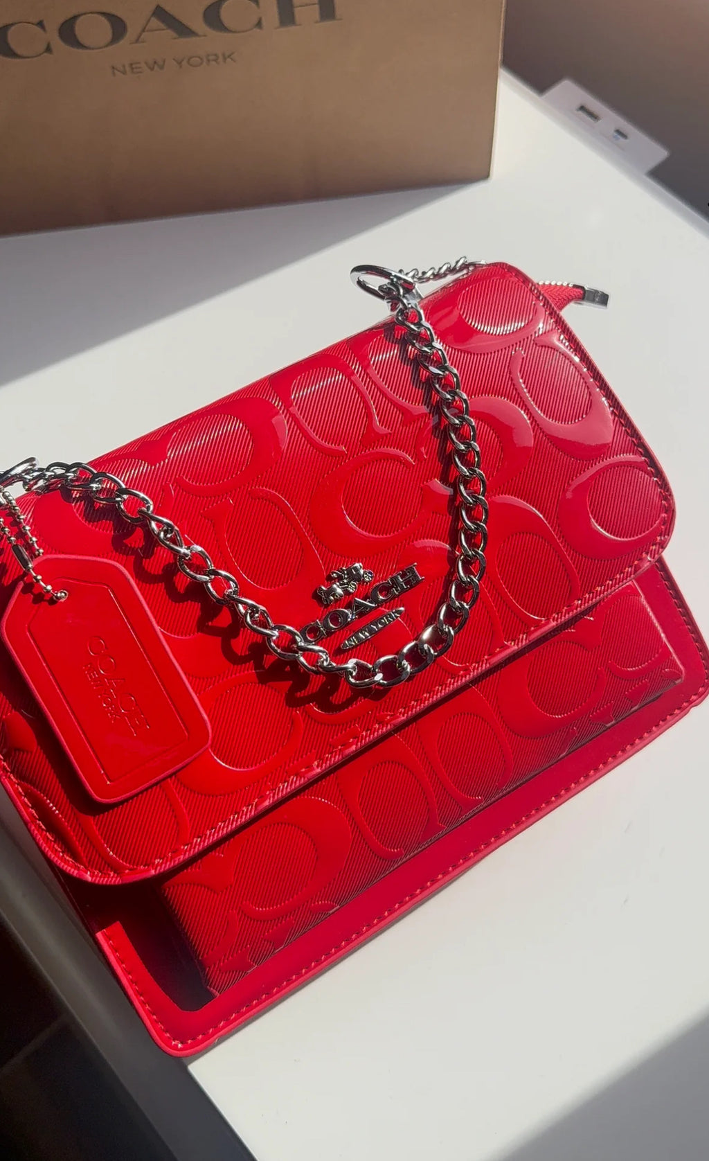 Red purse with silver straps