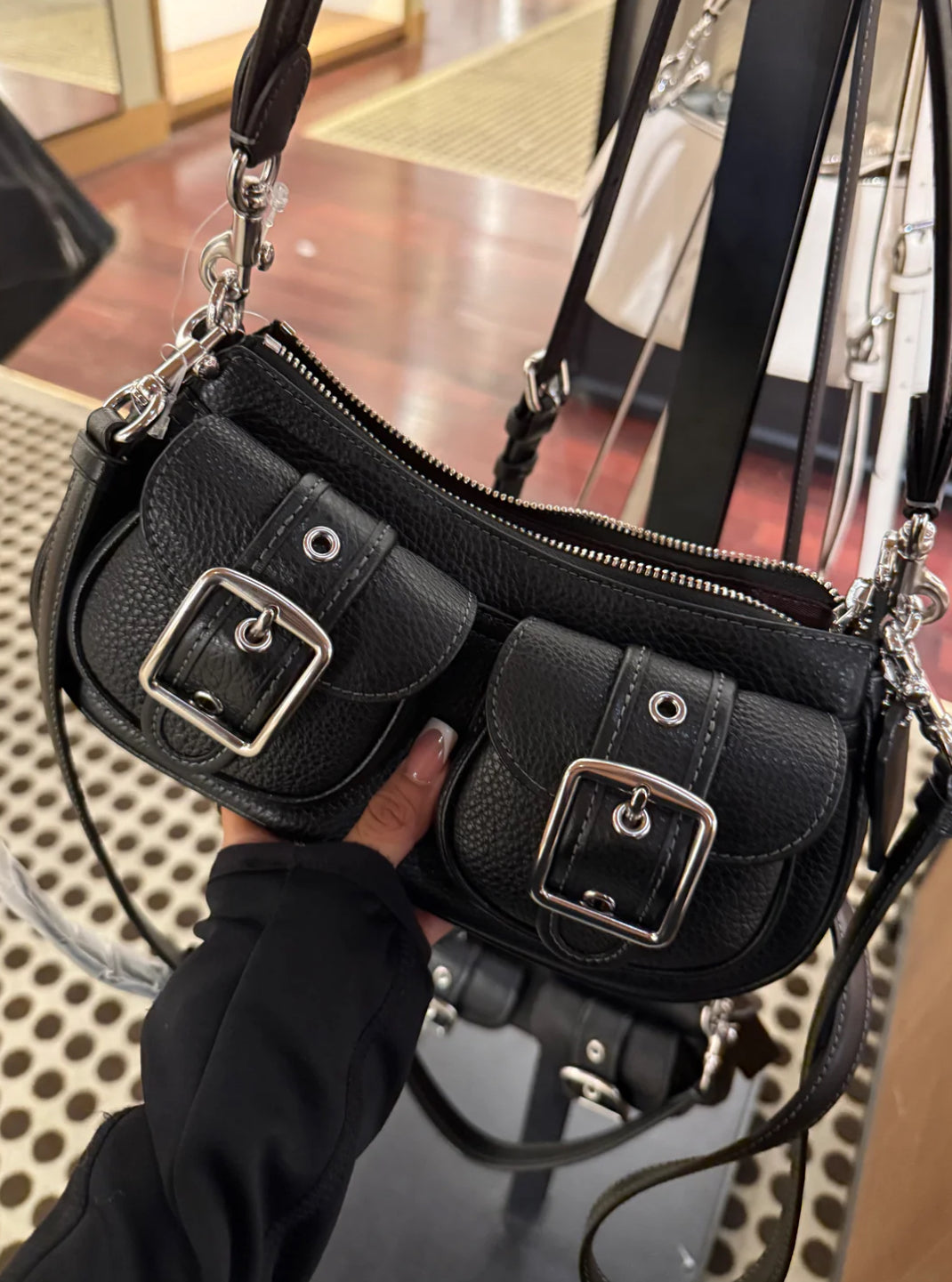 Black purse with cross body strap