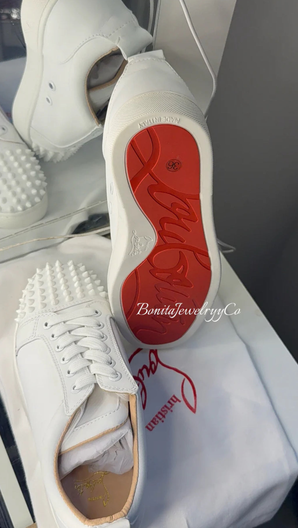 Unisex White red sole shoes