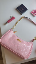 Soft pink purse with gold straps